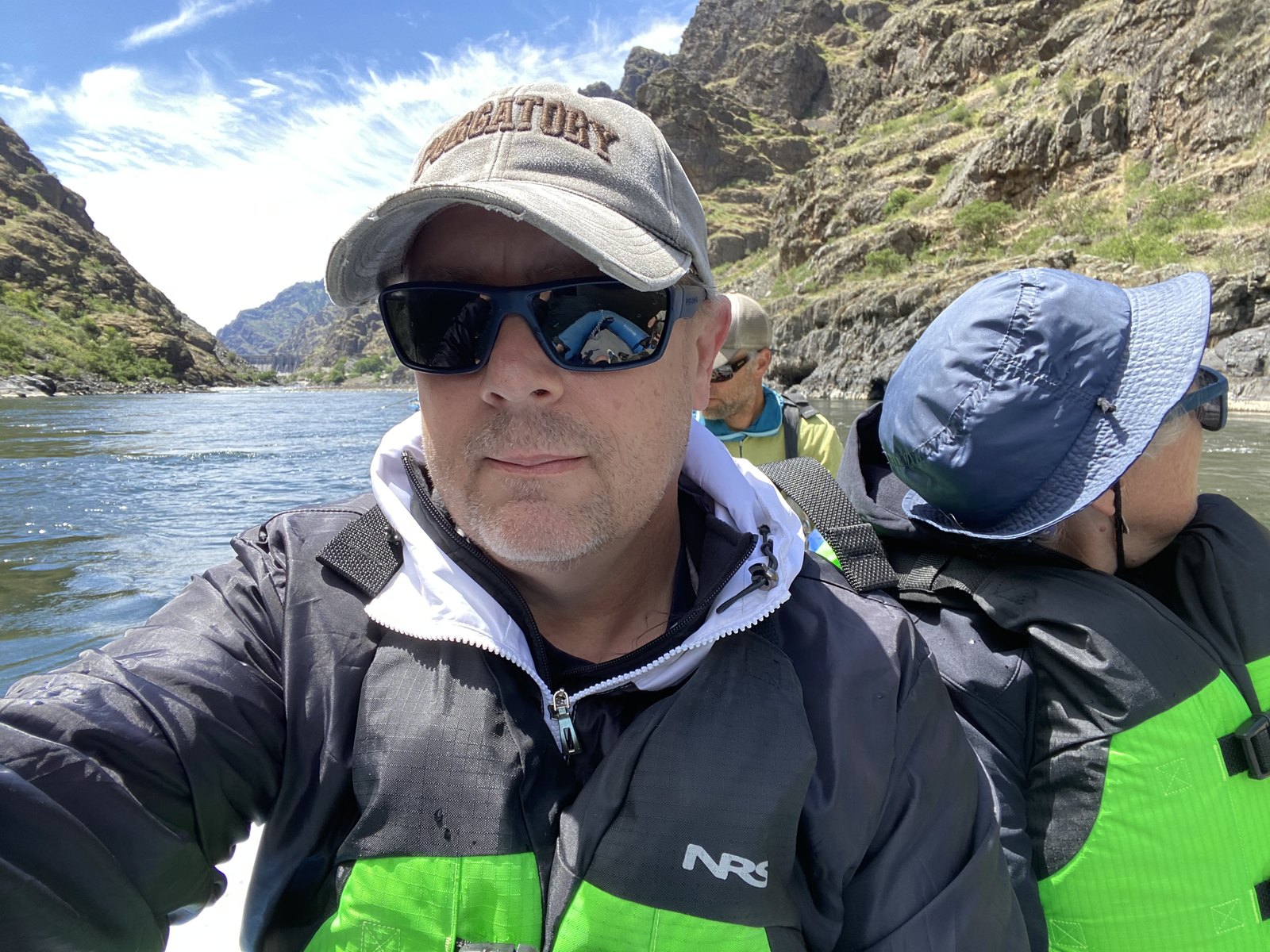 James Barcus in a cap and sunglasses on a river trip