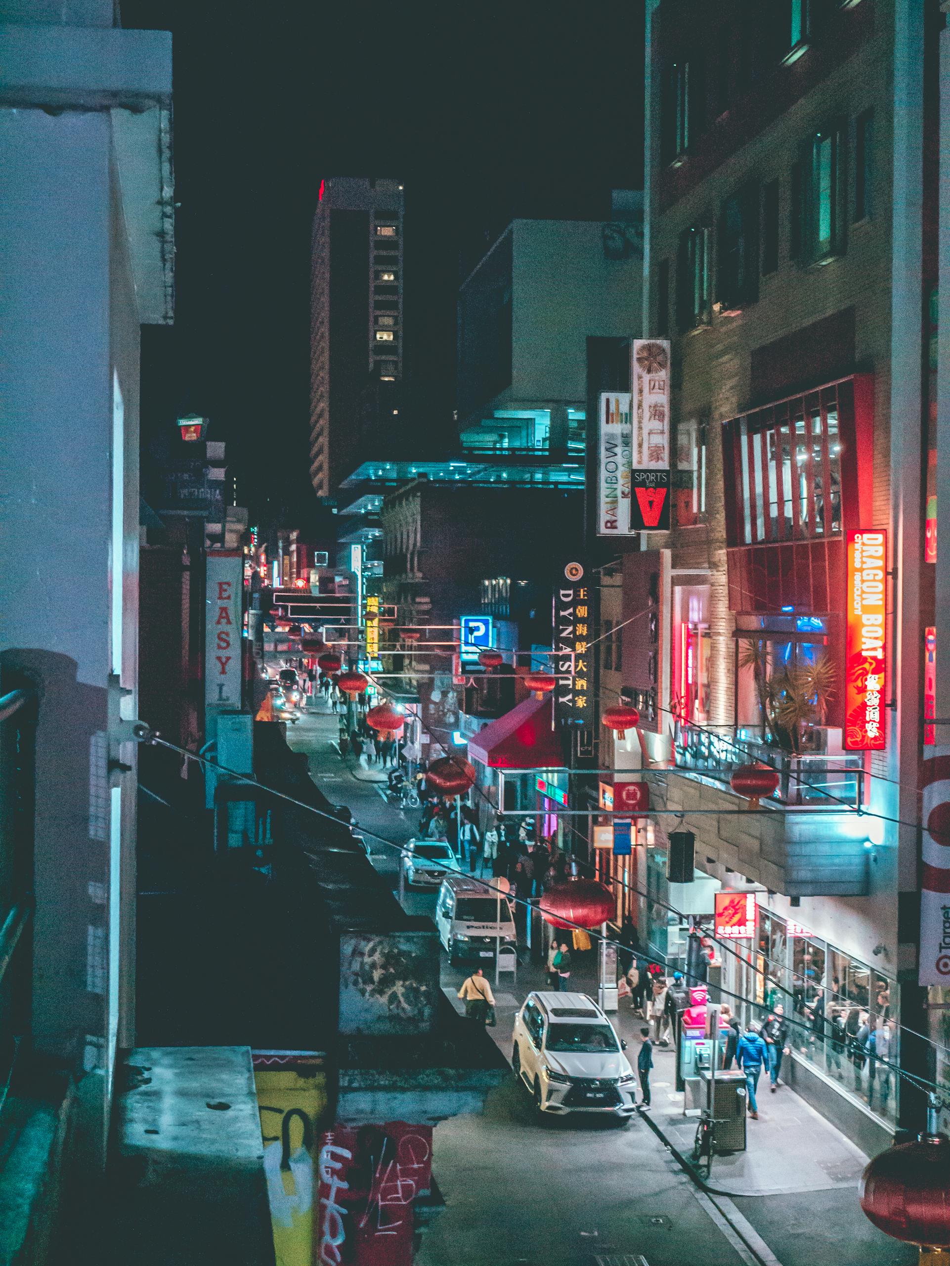 Explore the bustling nightlife and vibrant neon signs of downtown Melbourne, Australia.