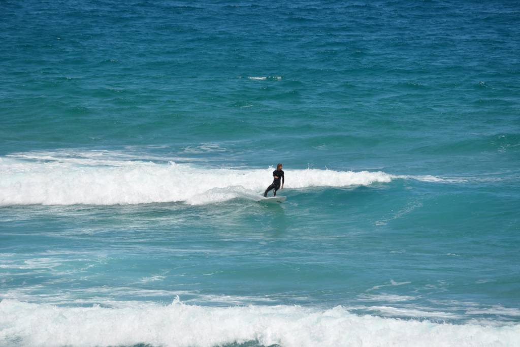 A man surfing.