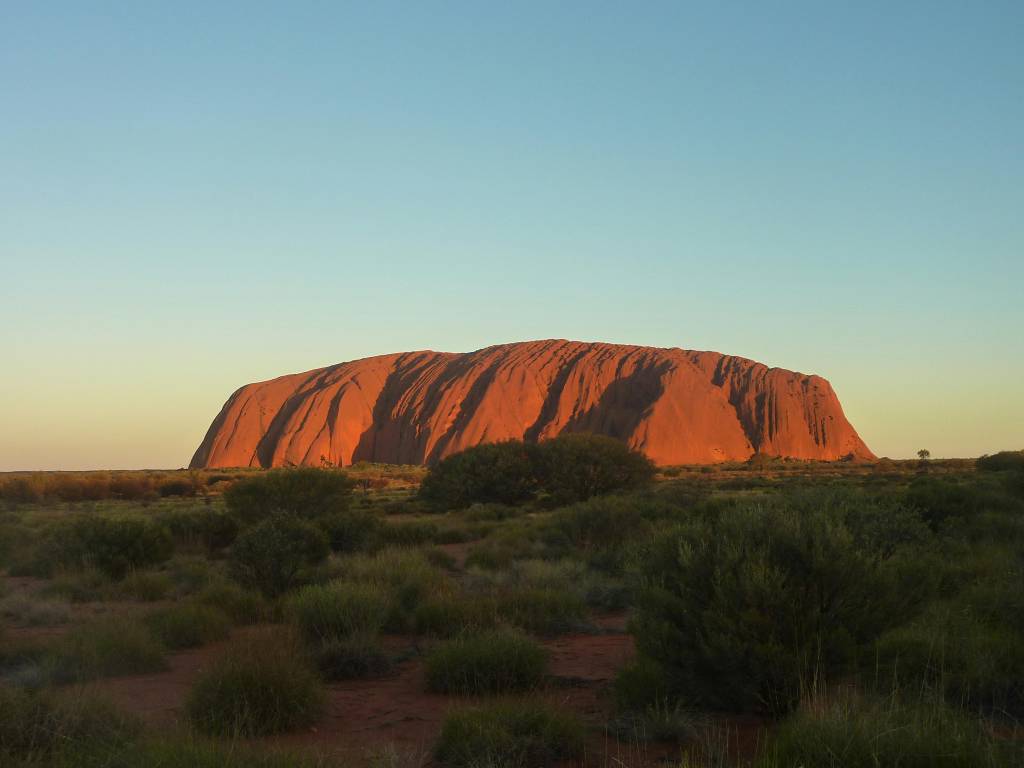 Uluru (Ayers Rock - Visit Australia's most iconic natural landmark for picturesque sunsets and untold beauty.