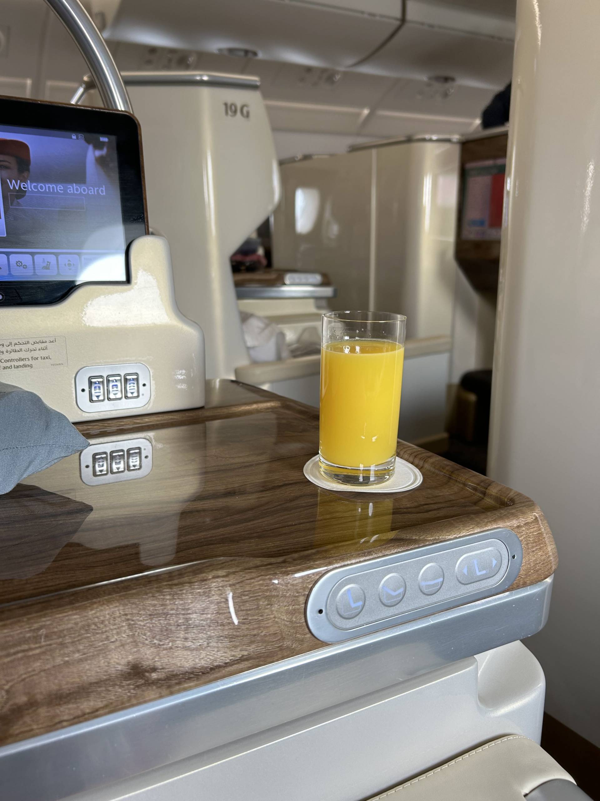 Having orange juice in first class as the beverage before take off.