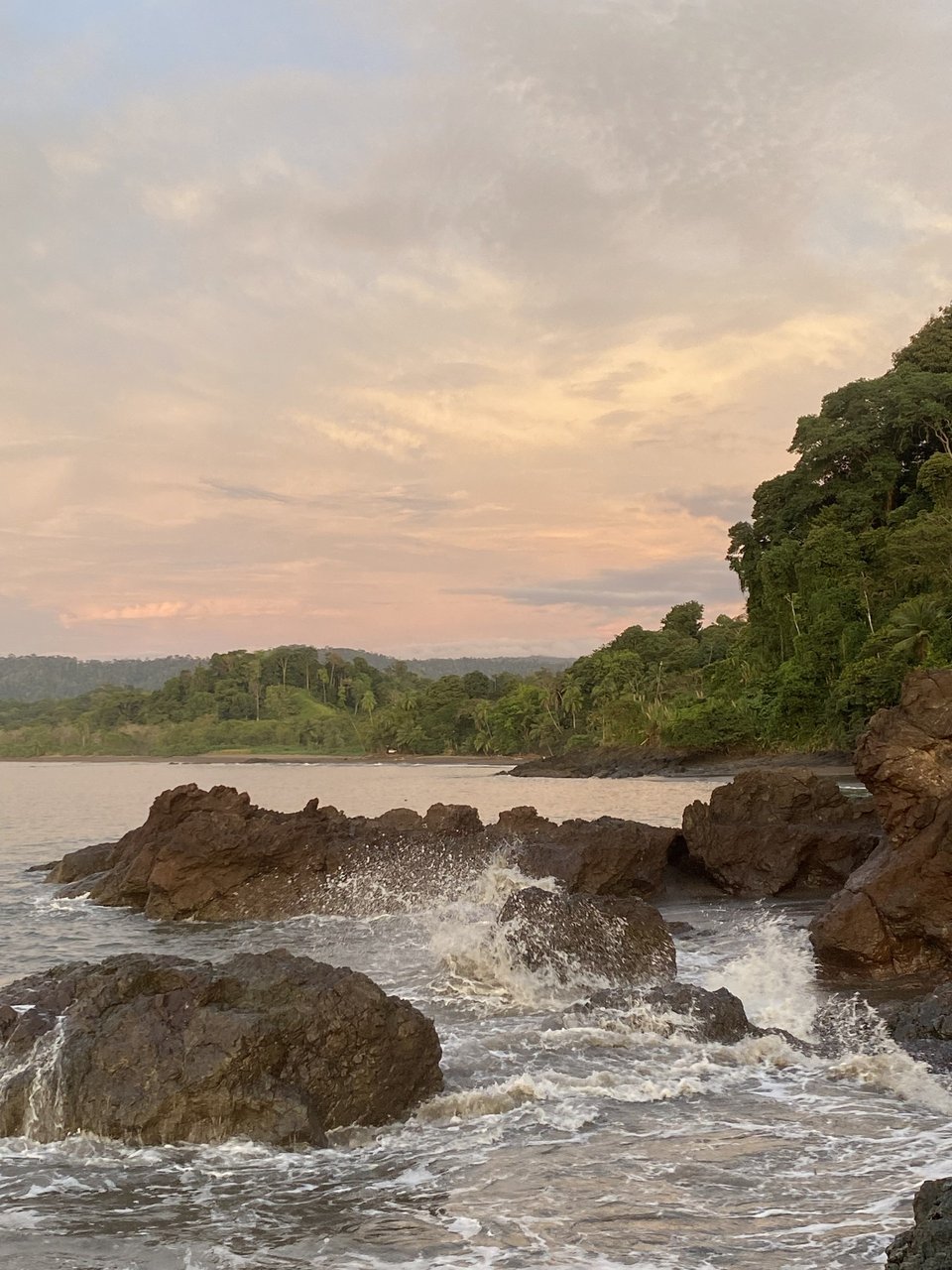 Sunset over the rocky Pacific coast near Uvita