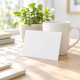 Blank notecard beside a coffee mug