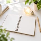 Open notebook and a light bulb