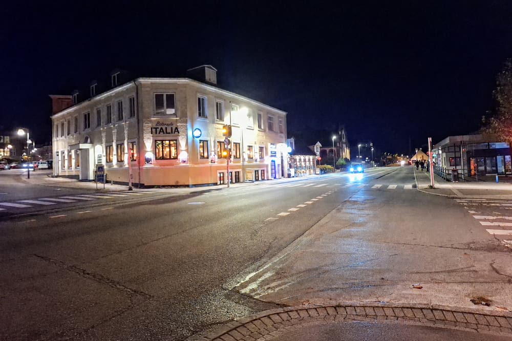 Ristorante Italia facade in the evening with the illuminated sign on the corner at Farimagsvej