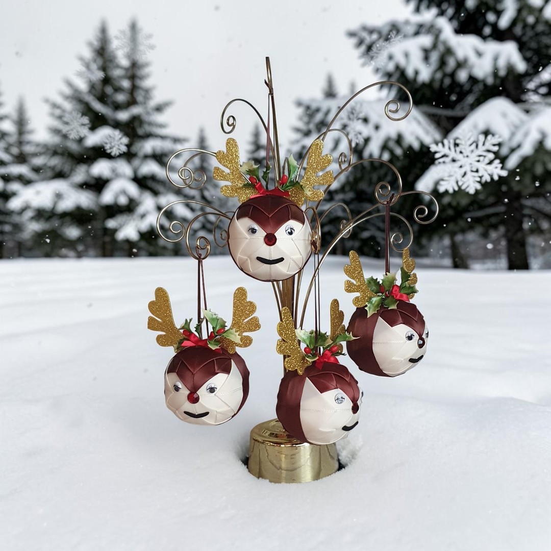 Close-up of the reindeer bauble's cheerful face with holly on top