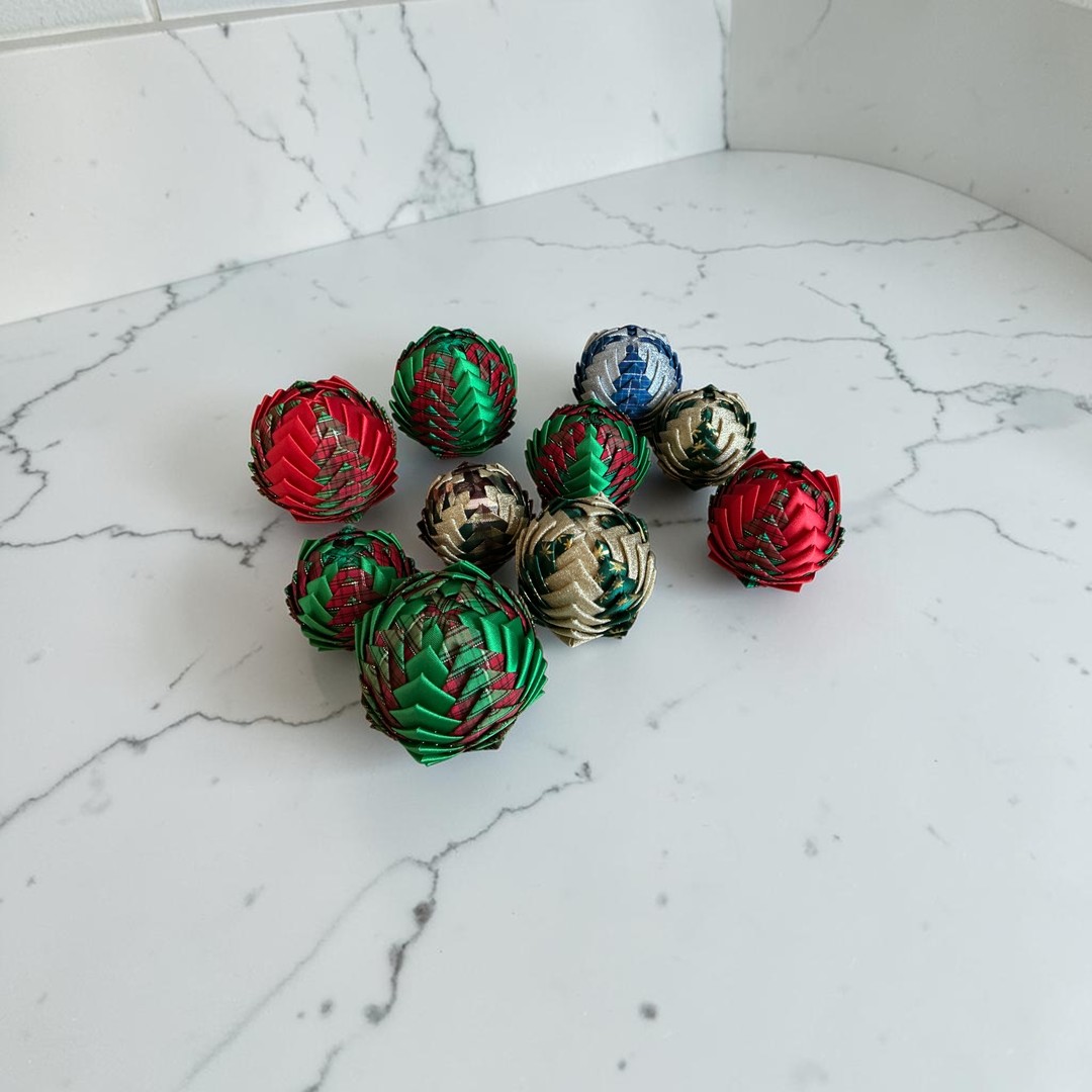 Work in progress: a folded ribbon bauble taking shape, fold by fold