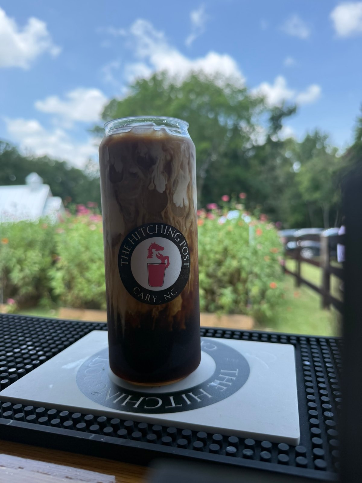 The Hitching Post branded canned coffee served at an event