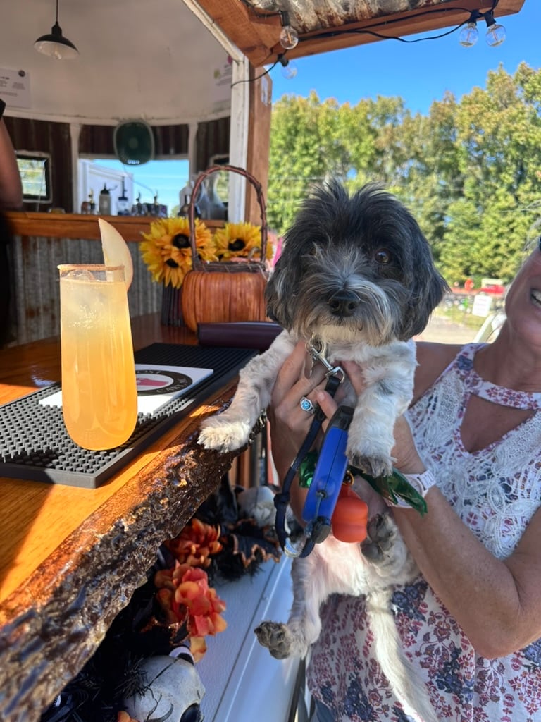 Guest enjoying a hand-crafted drink at The Hitching Post mobile bar