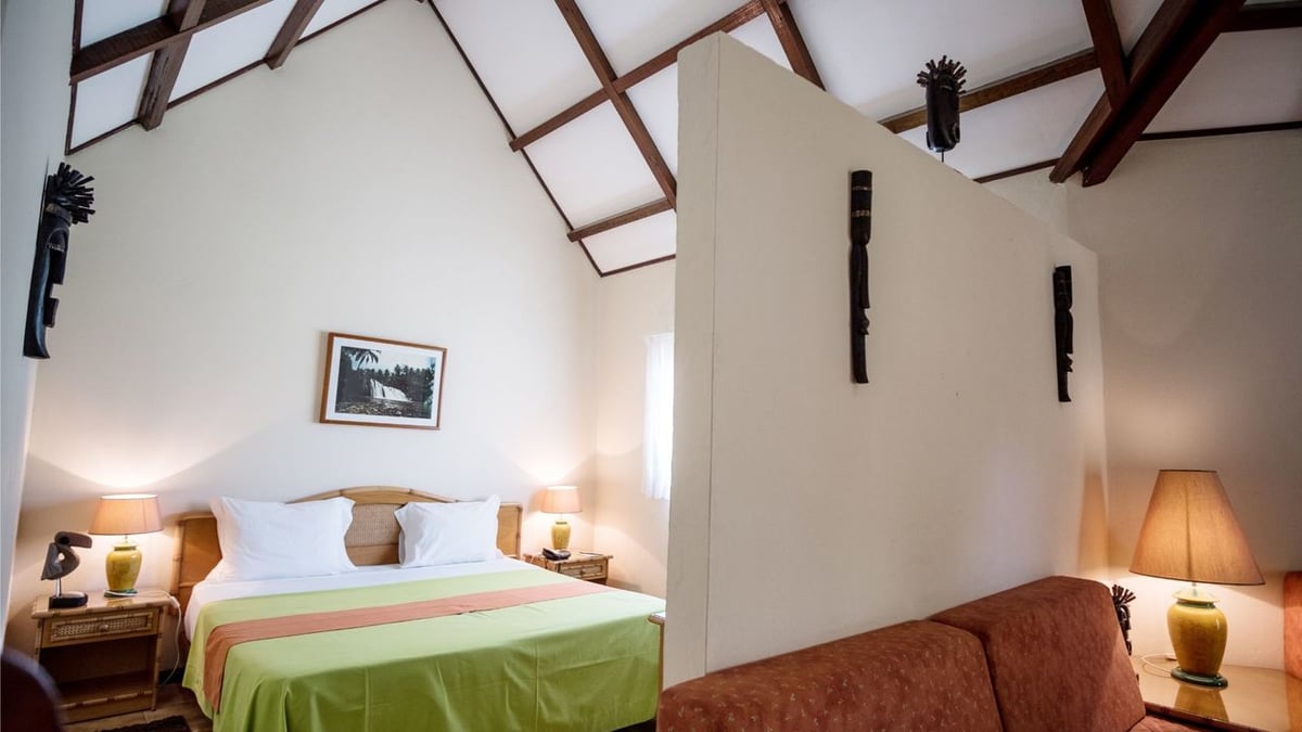 Family bungalow bedroom and living area at Club Santana Beach & Resort