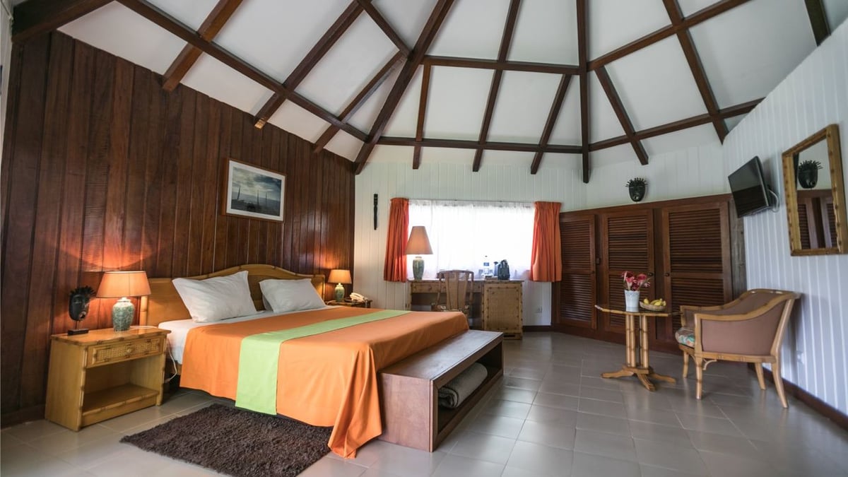 Standard bungalow bedroom at Club Santana Beach & Resort
