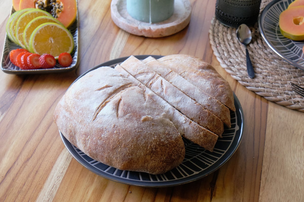 Artisan sourdough bread with tropical fruit breakfast at Wabi Sabi