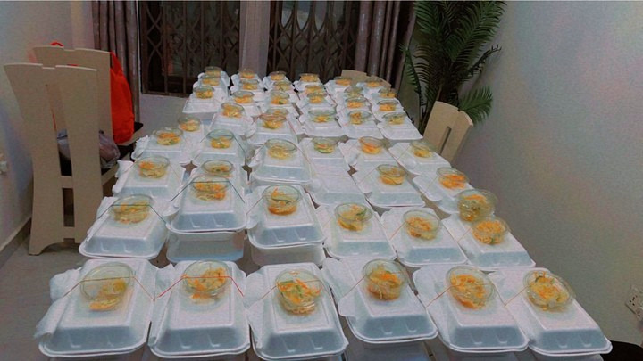 Rows of packed hot meal boxes ready to be distributed to families in Accra