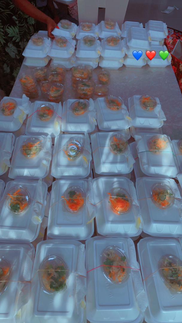 Meal containers packed and ready for outdoor distribution event in Ghana