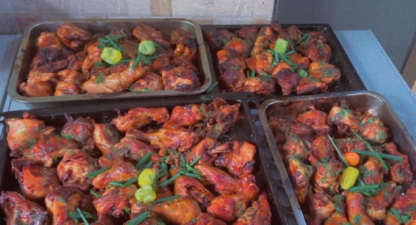 Freshly cooked chicken prepared for the weekly meal distribution in Ghana
