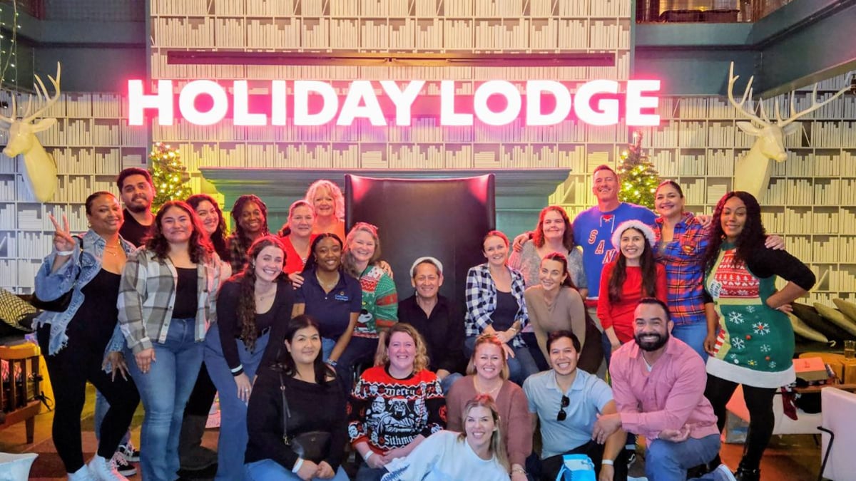 The full Coast Care team celebrating together at their annual company holiday event