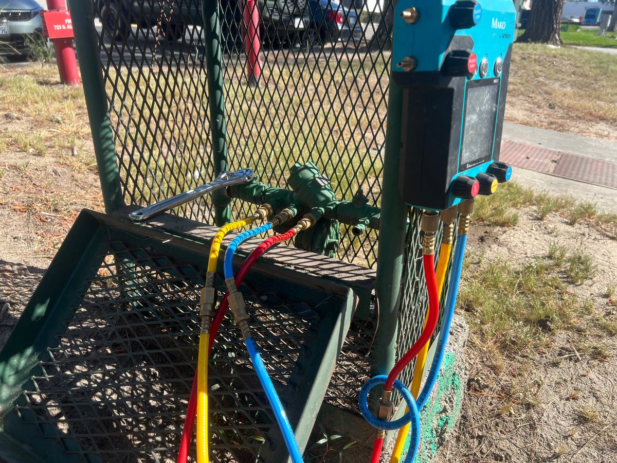 Backflow assembly testing in progress — Mako gauge with test hoses