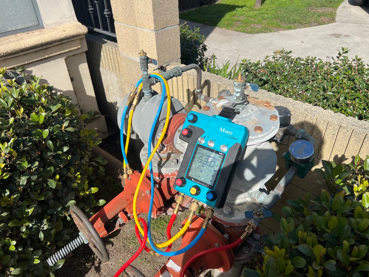 Large backflow assembly test in progress with Mako gauge