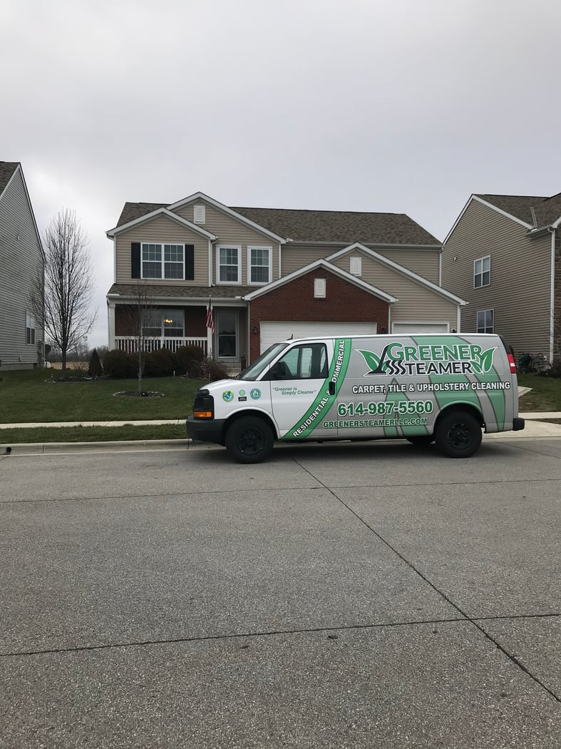GREENER STEAMER branded van on a Columbus street