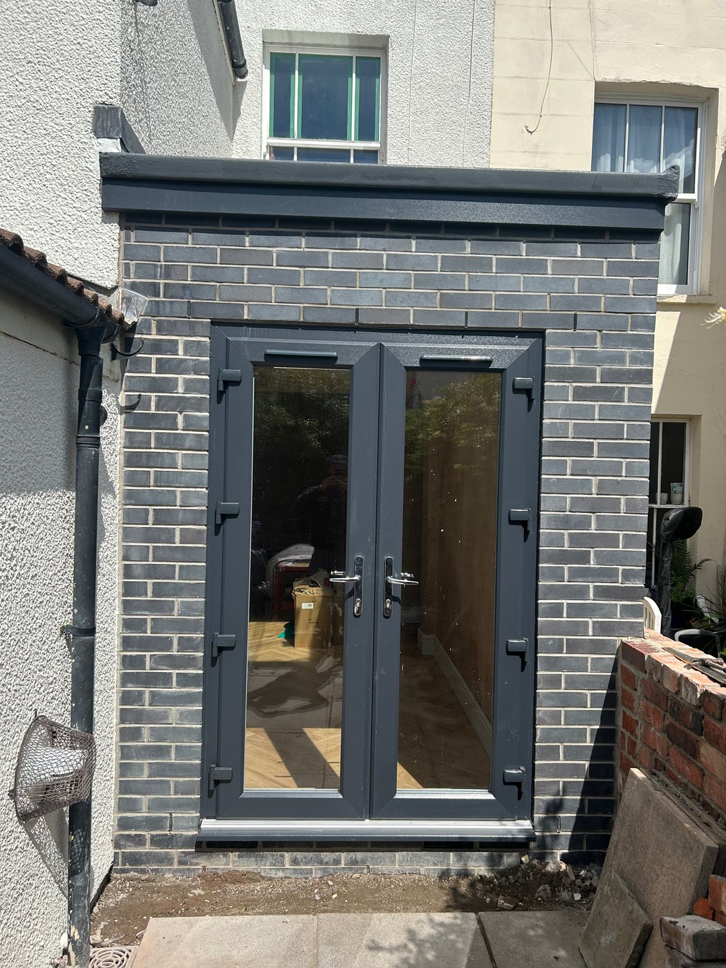 Patios and garden bed with railway sleepers