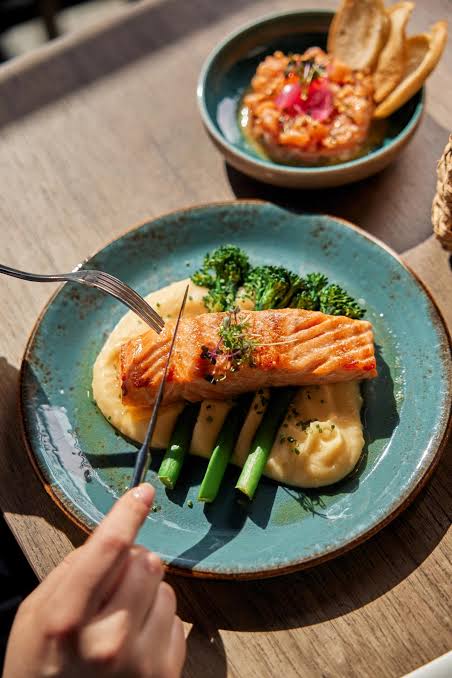 A fresh salmon dish on a plate