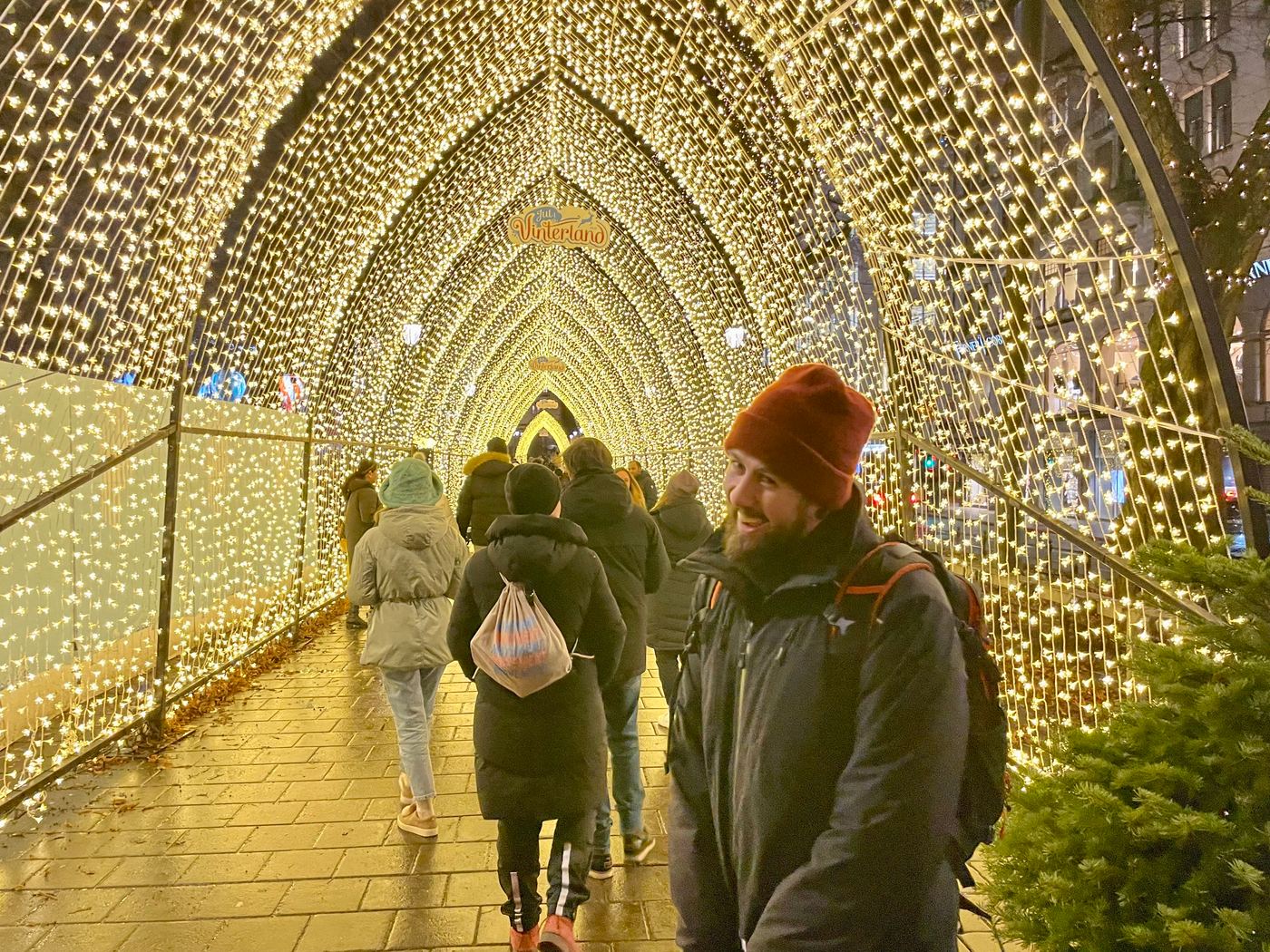 Walking through the glowing light arches of Christmas in Winterland in Oslo