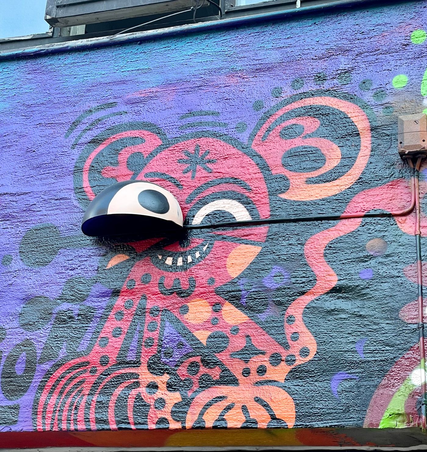 Large colourful graffiti mural covering a wall in Grünerløkka, Oslo