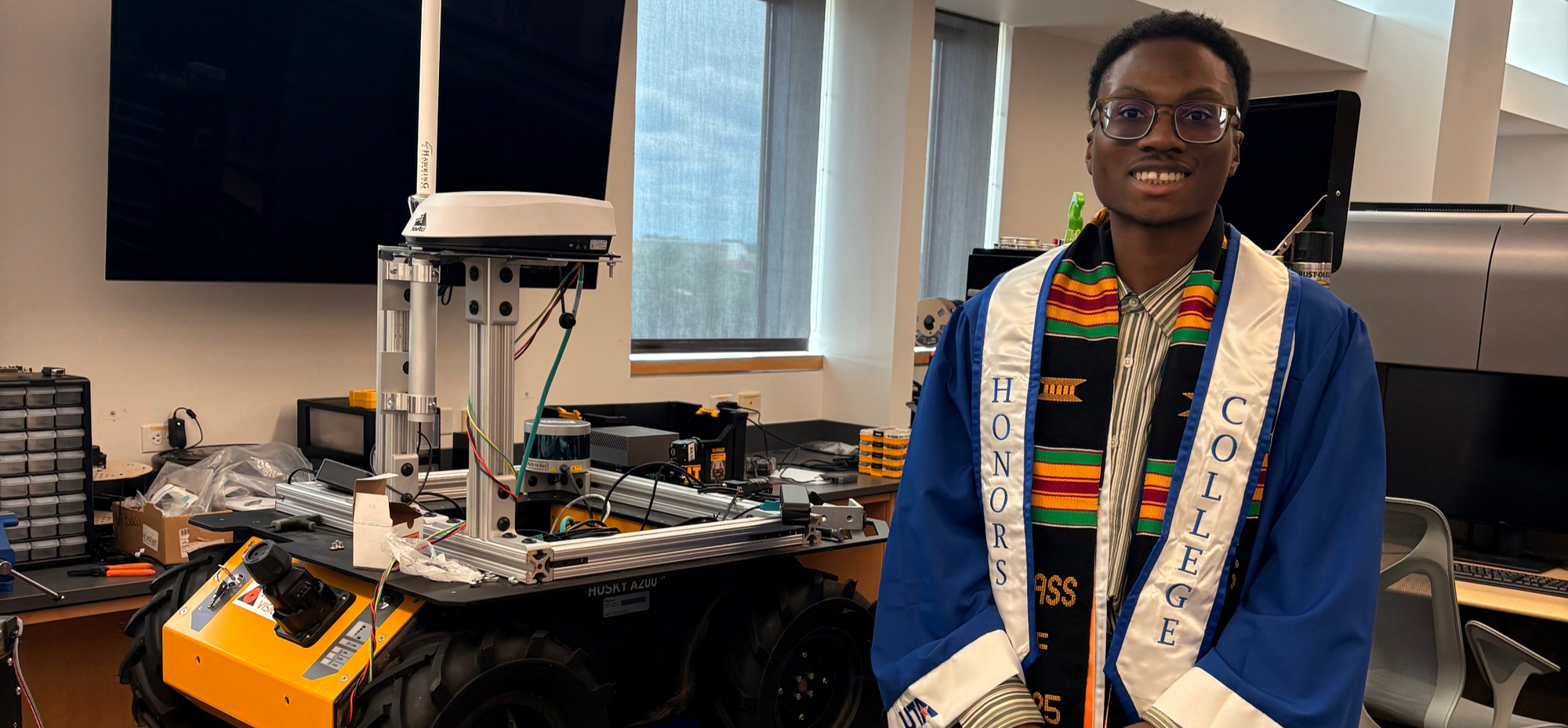 Anthony Aiyedun with robotics equipment