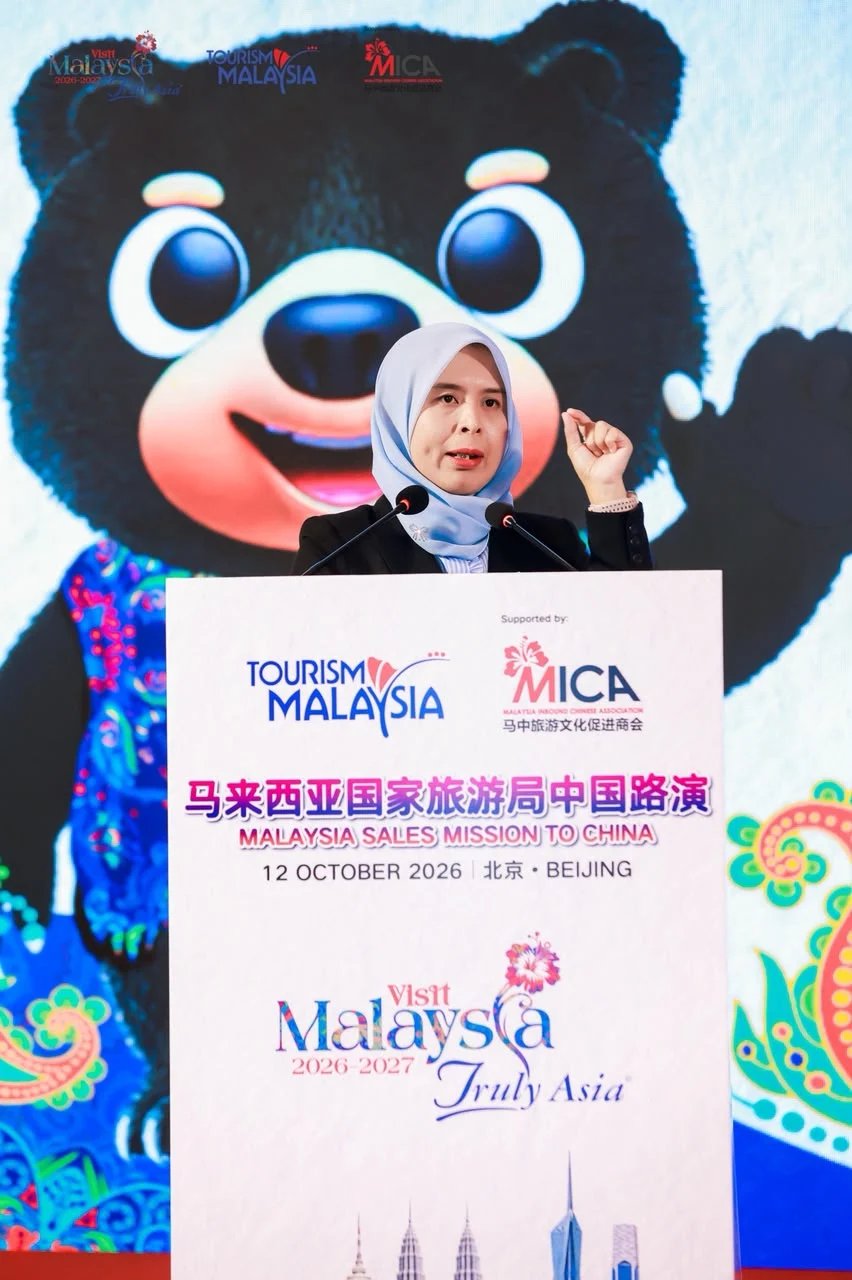 Waffa Wahida Zainol speaking at a rostrum at the Malaysia Sales Mission to China event in Beijing