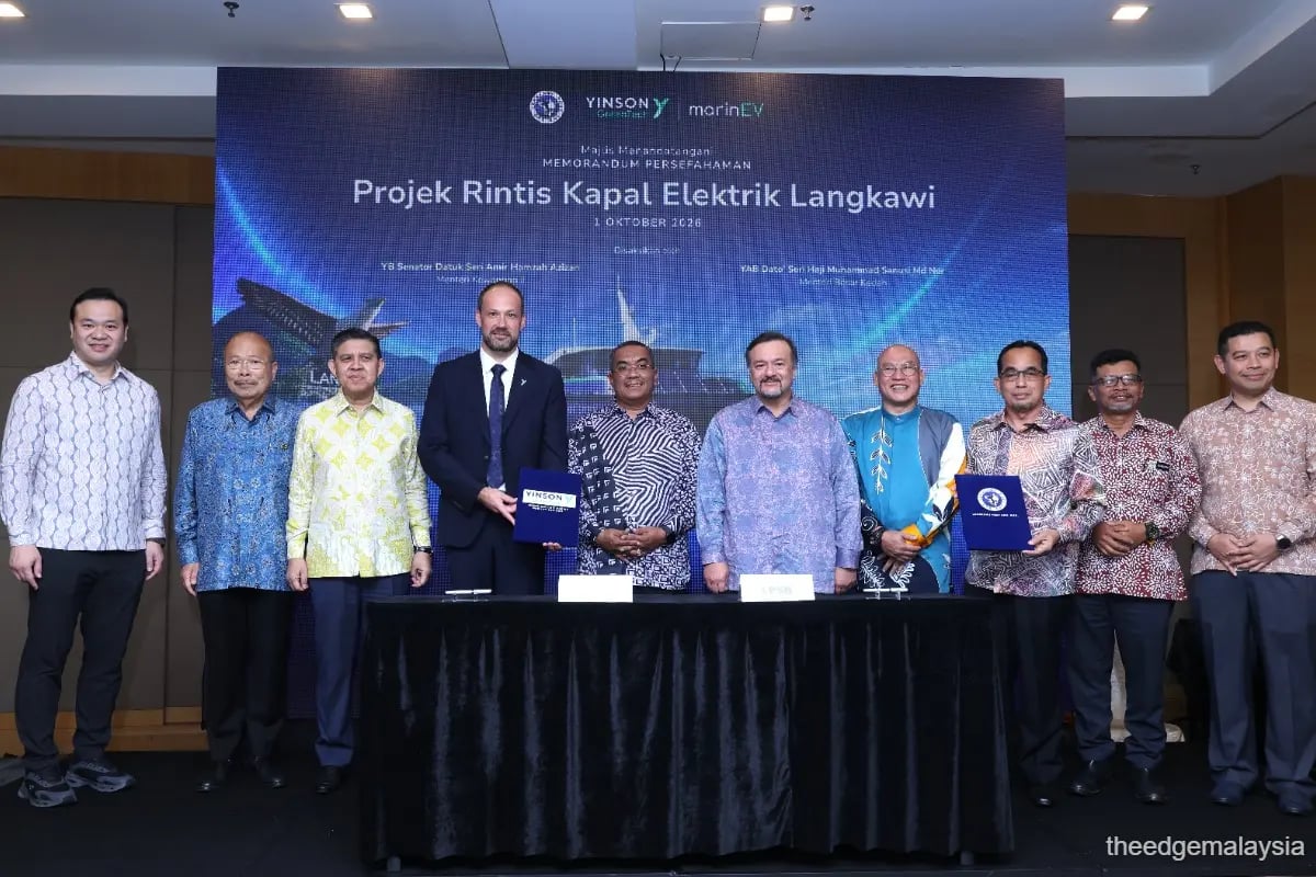 Yinson GreenTech, marinEV and Langkawi Port Sdn Bhd representatives on stage at the MoU signing ceremony