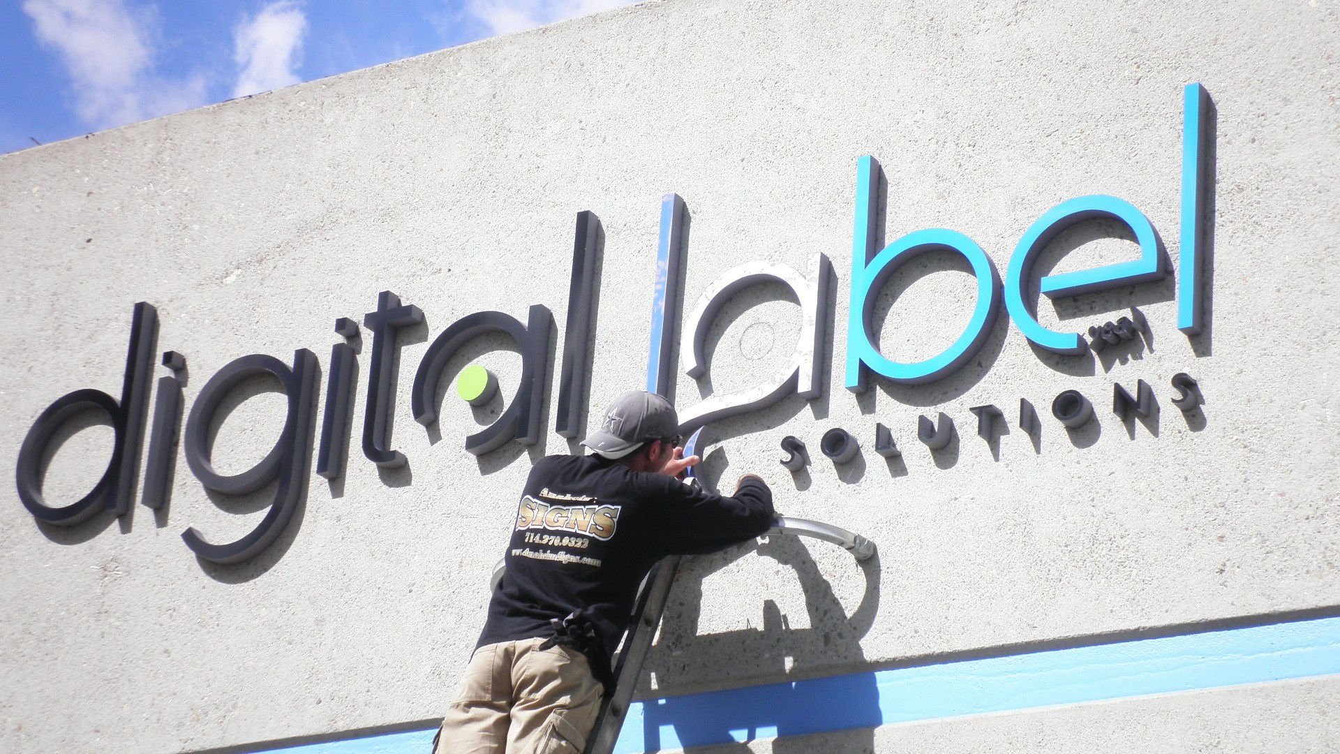 Anaheim Signs team installing channel letters for a client in Orange County