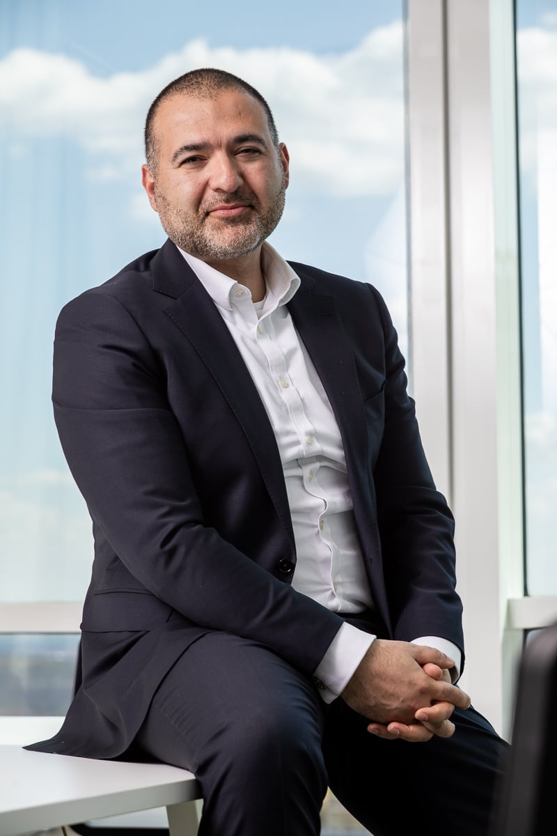 Defense attorney Martin Murad seated at PEERS law firm Prague