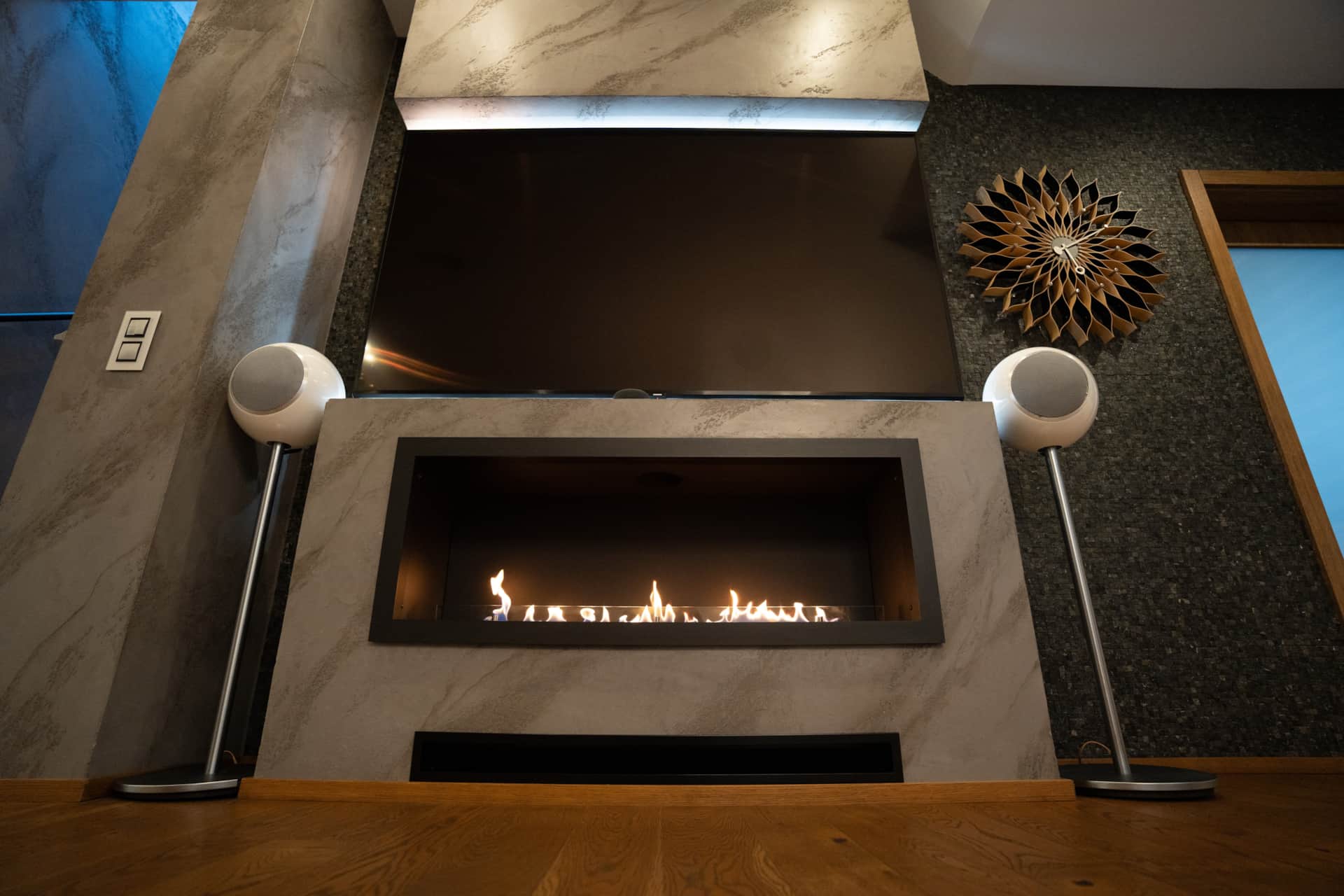 Living room gas fireplace with TV and speakers