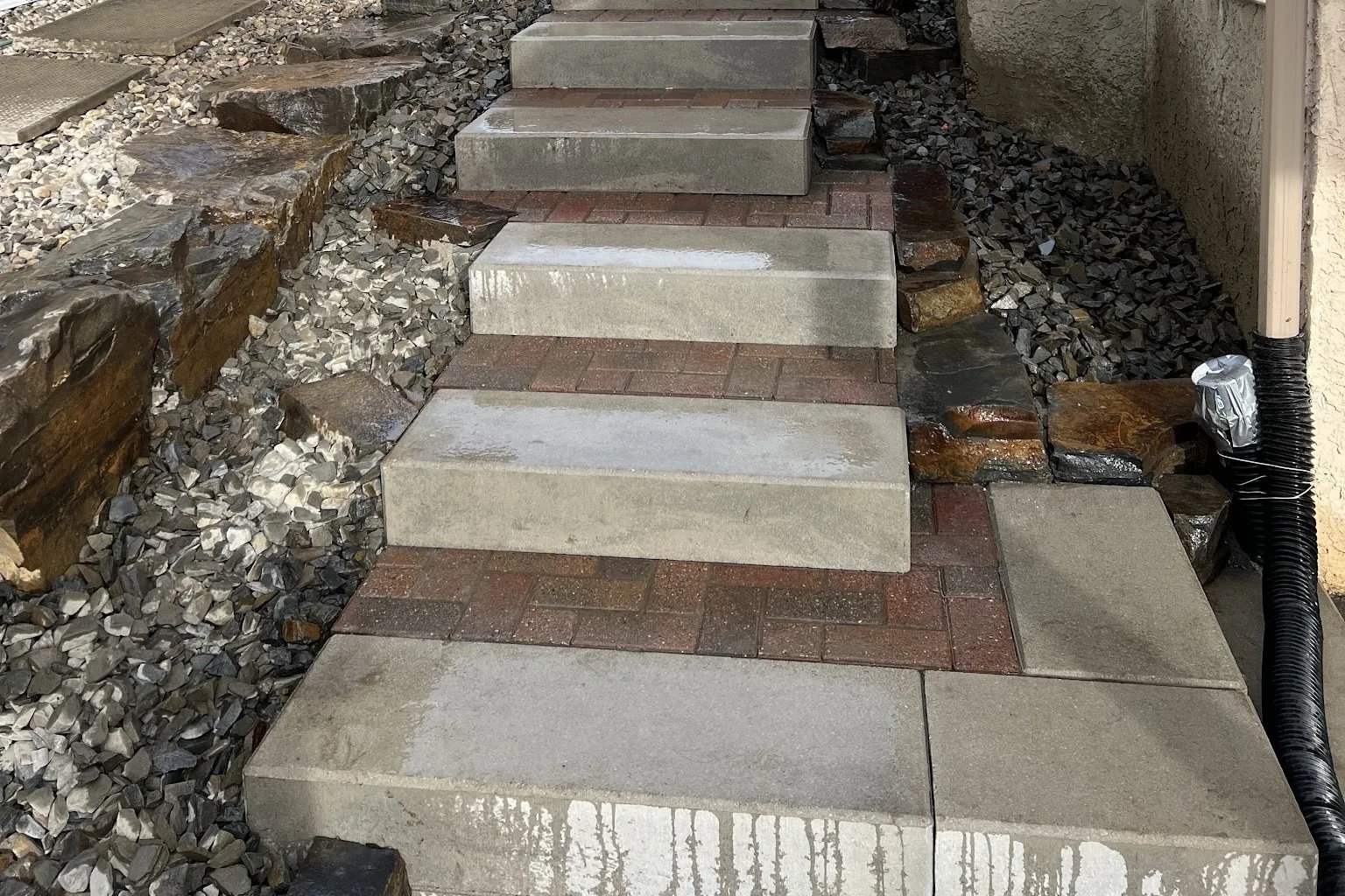 Paver step risers with rock landscaping detail, Calgary hardscaping by All The Moore