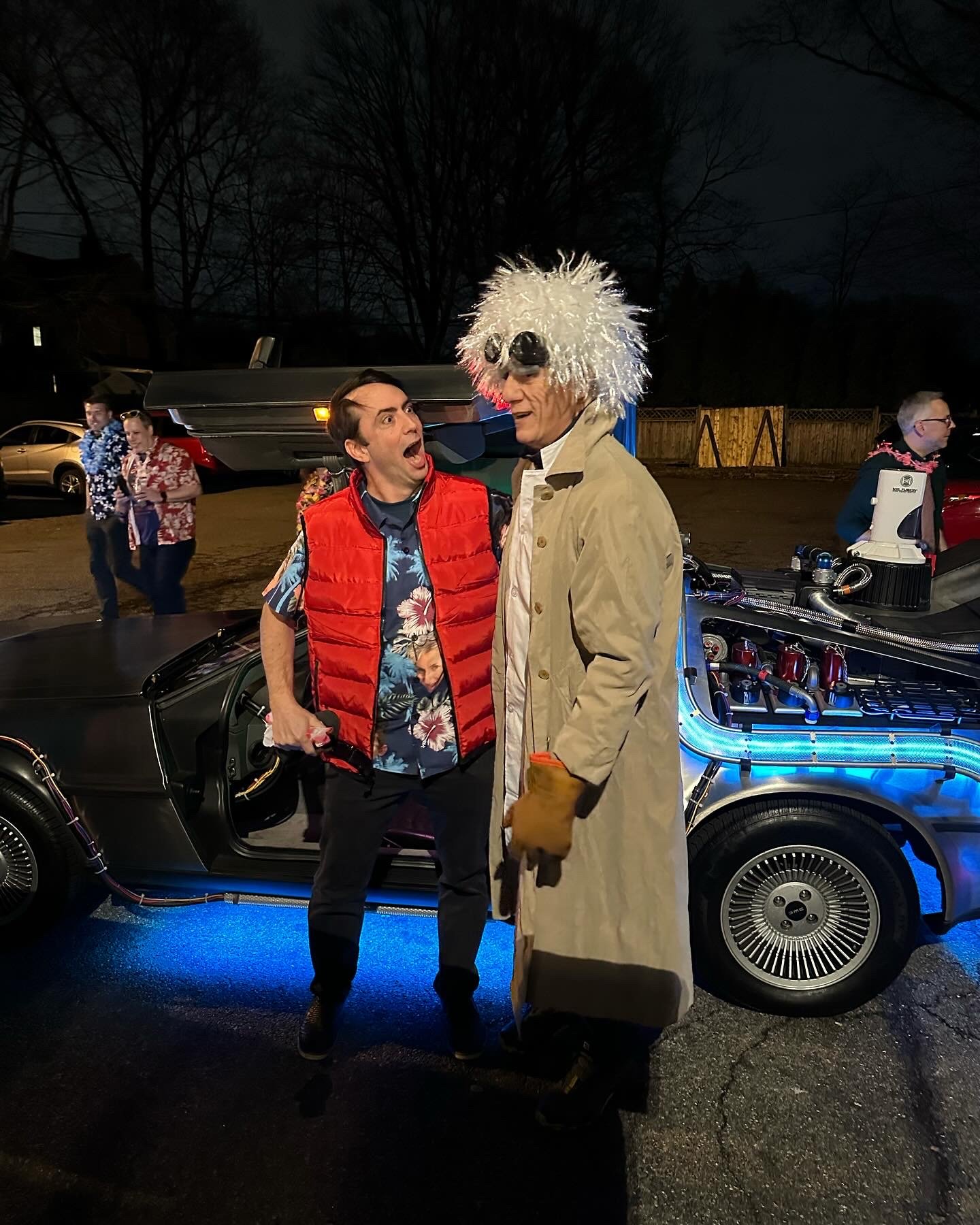 Marty McFly and Doc Brown costumed guests at a DeLorean event