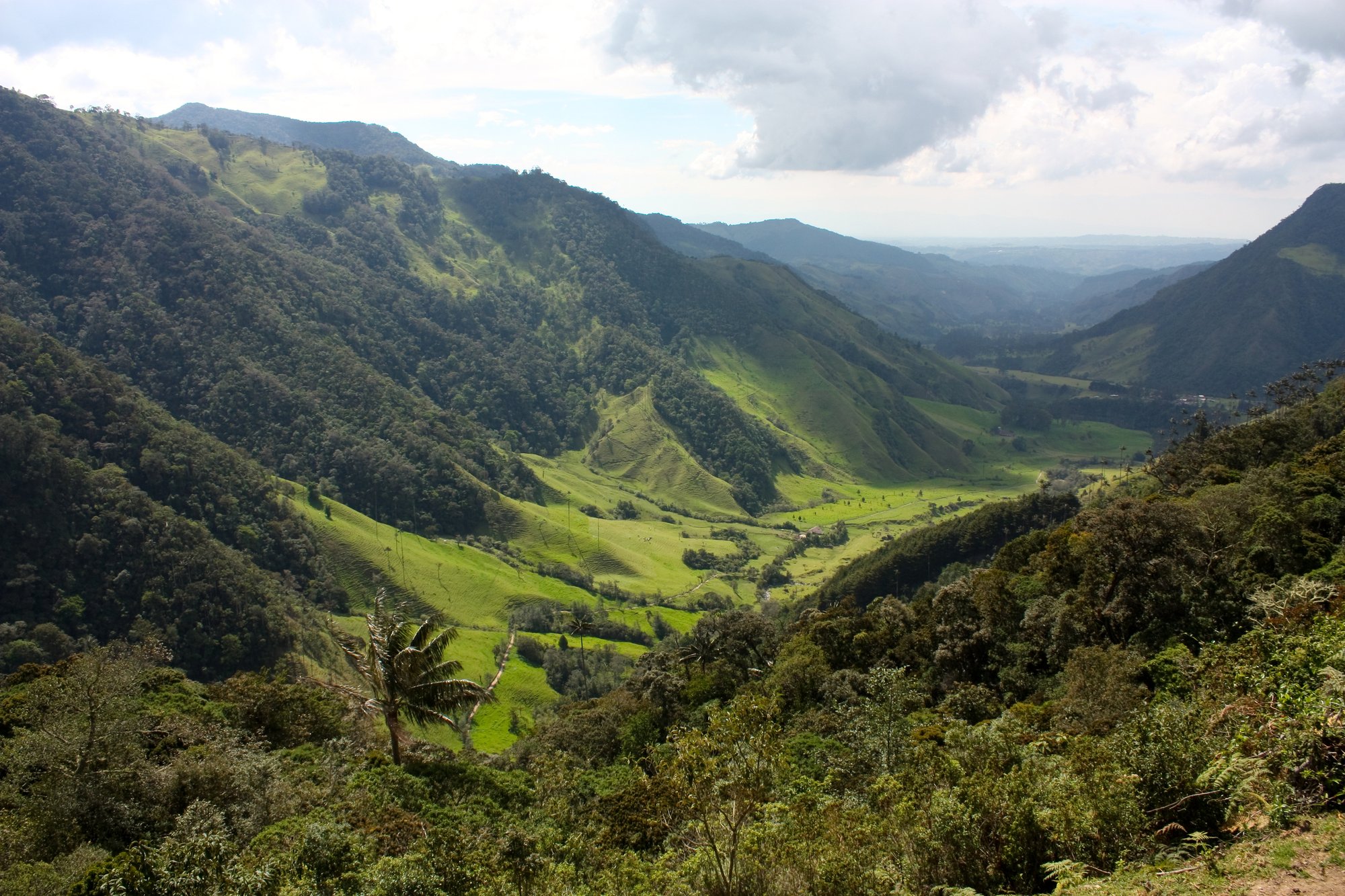 Dramatic mountain landscape with mist drifting over peaks and valleys