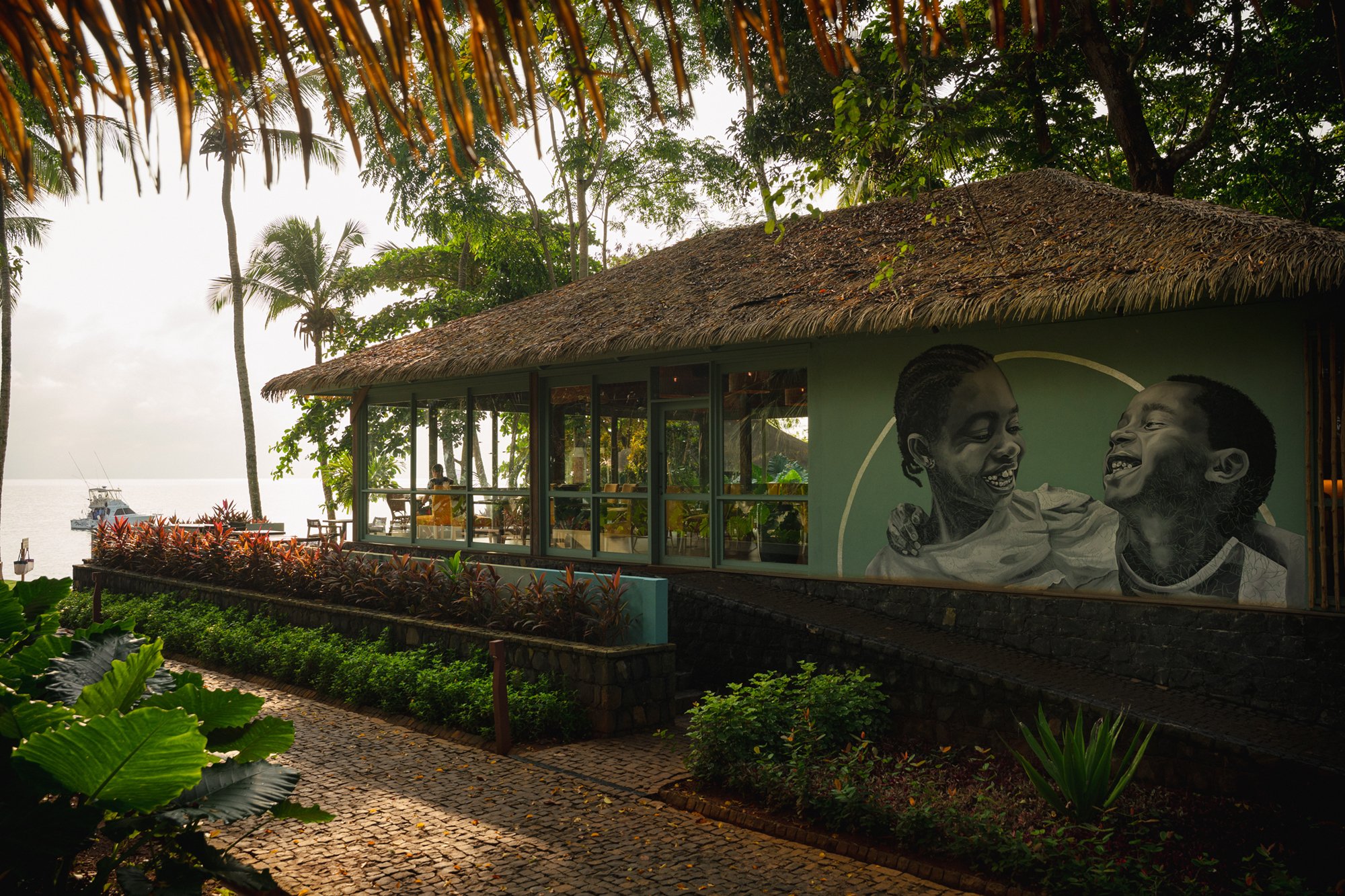 Bom Bom Restaurant beside the ocean, with views across the coastline
