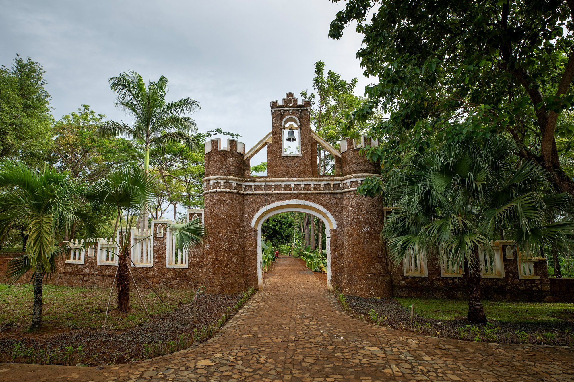 The restored stone gateway marking the entrance to the historic Belo Monte plantation estate on Príncipe