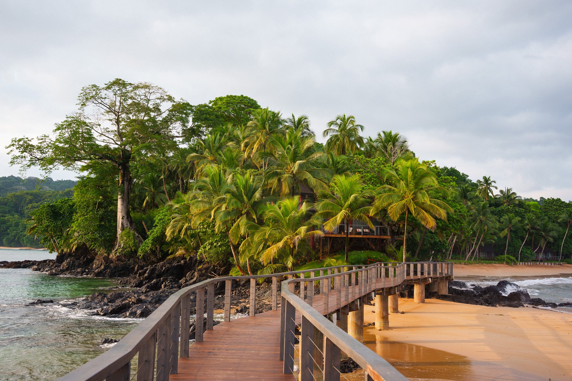 Wooden walkway crossing to the small offshore islet at Bom Bom on Príncipe