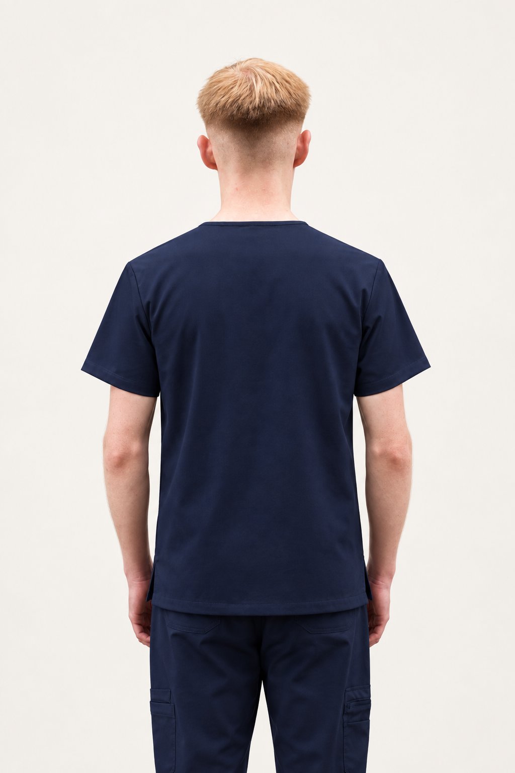 Navy pant cuff with a back seam slit and contrast stitching
