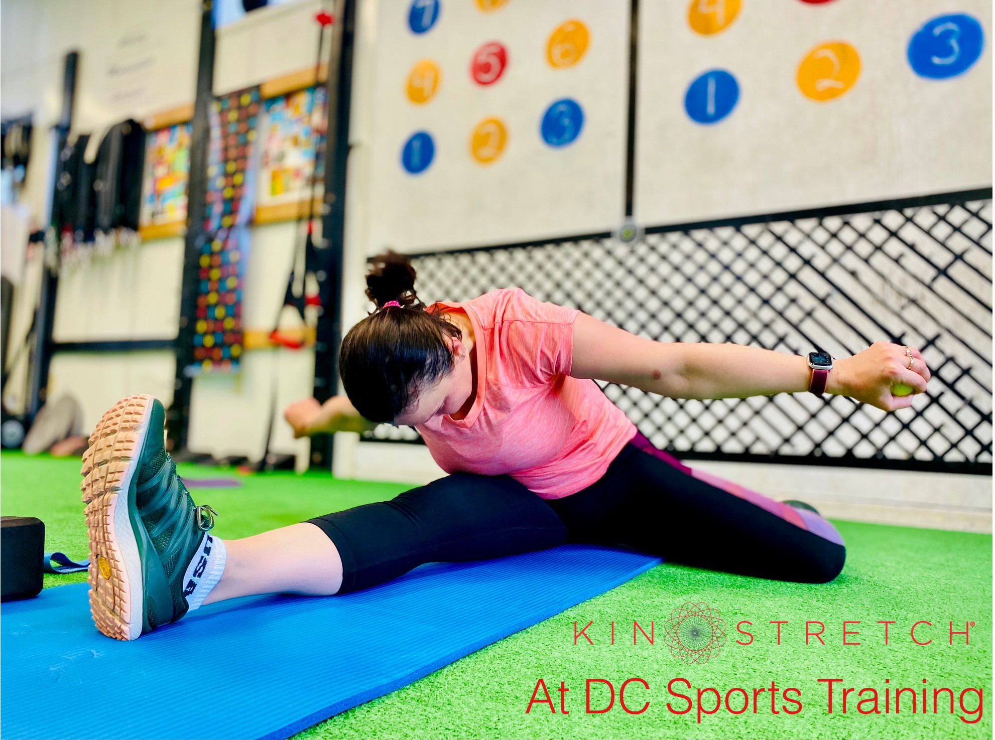 Athlete reaching into a deep hip stretch position