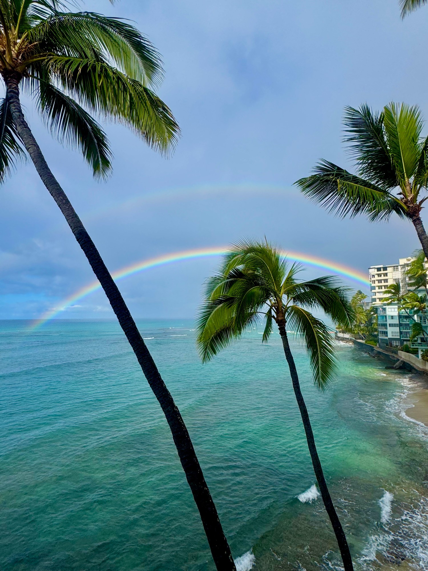 Double rainbow over the ocean seen from the building