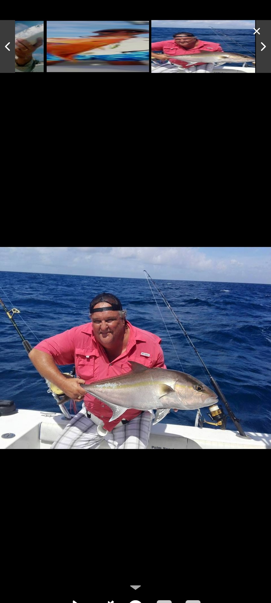Angler holding an amberjack caught jigging
