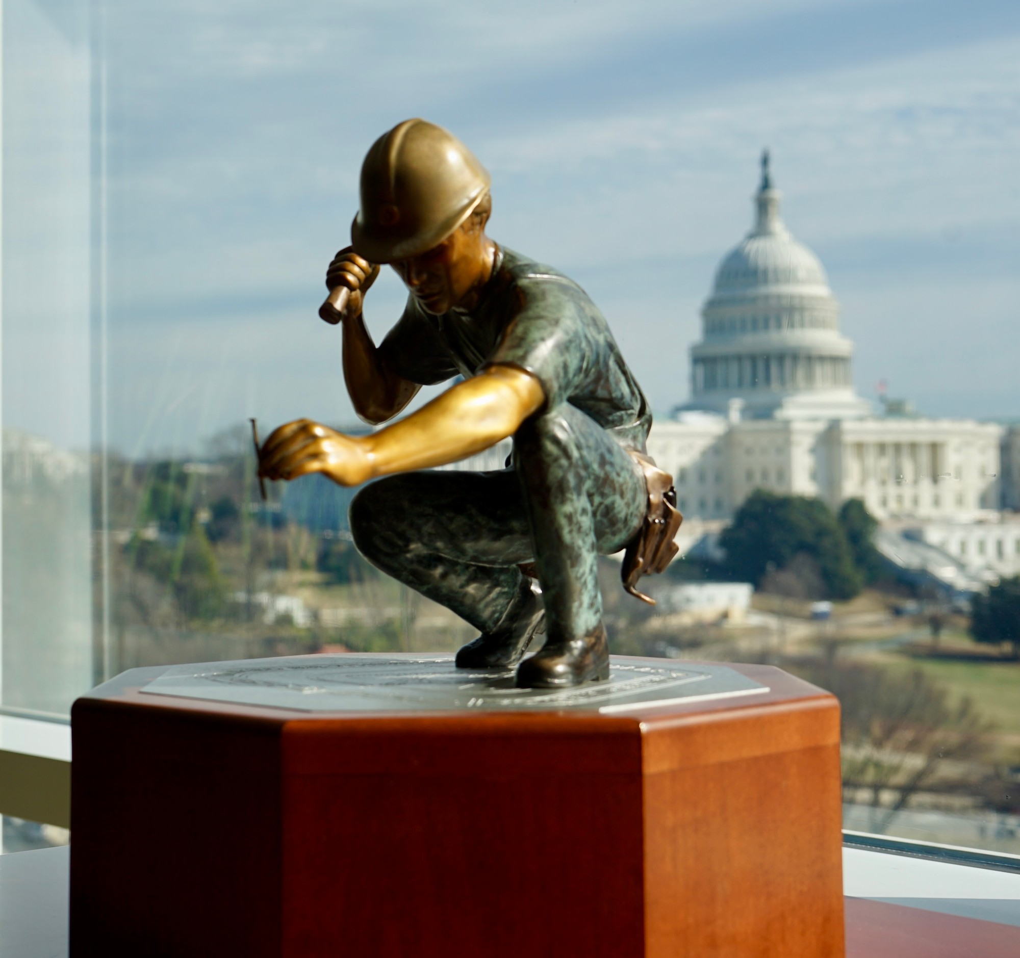 Bronze sculpture installation with Capitol building backdrop