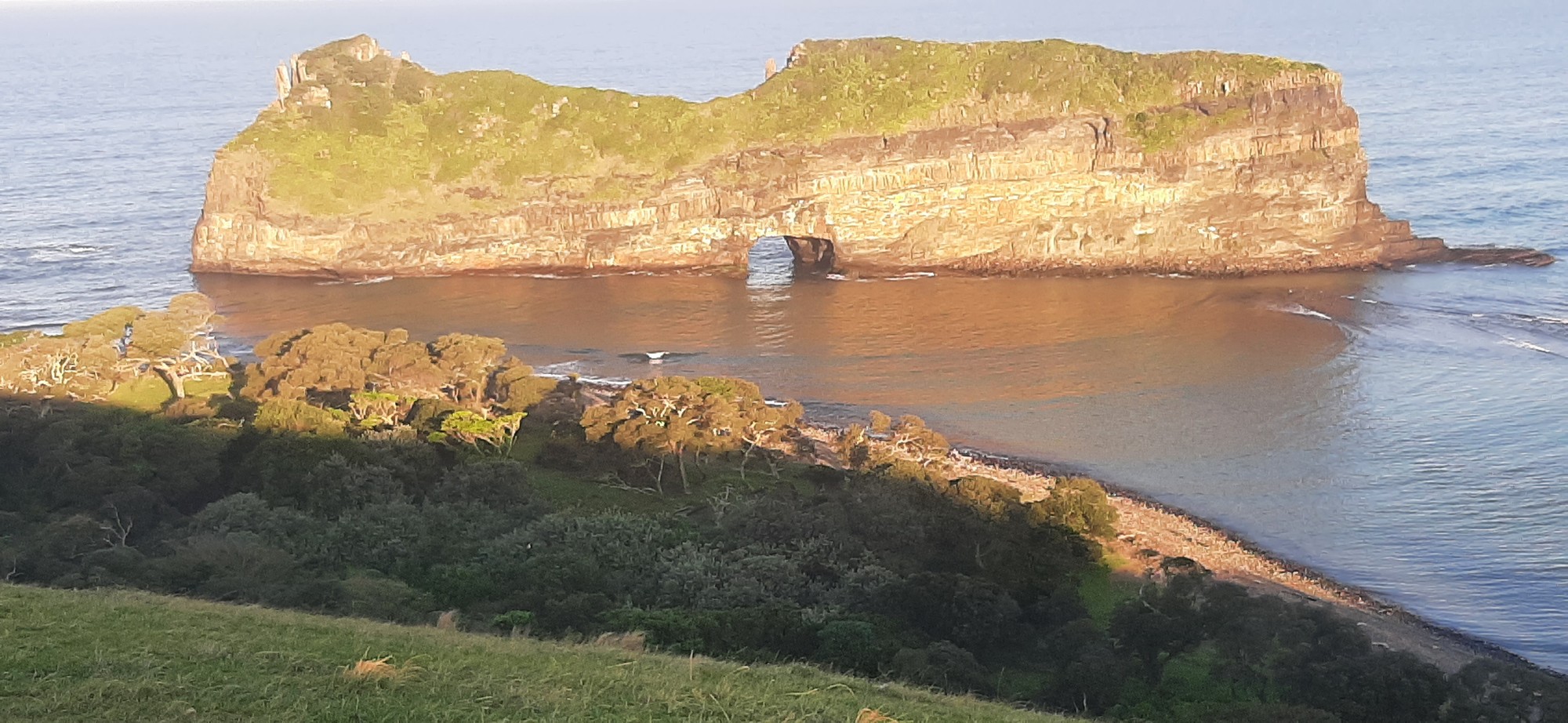 The famous 'Hole in the Wall' island and natural arch from above