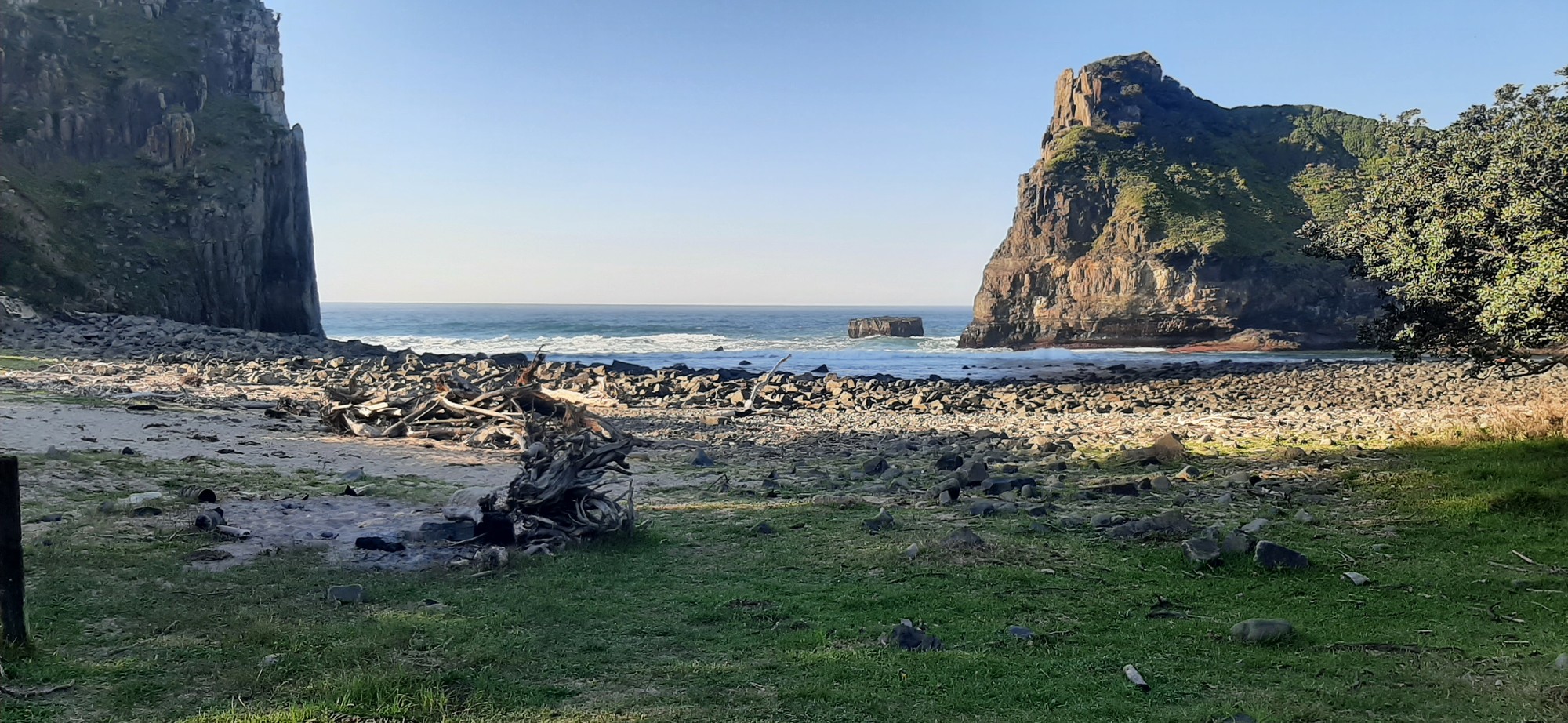 Wild Bay — dramatic cliffs frame the pristine beach below