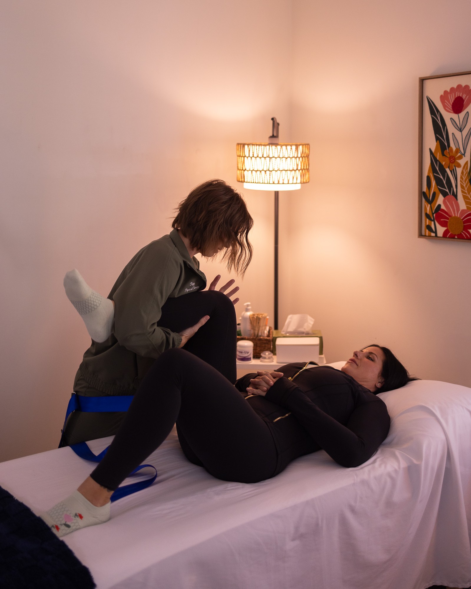 Emily Dumont explaining pelvic health with an anatomical model