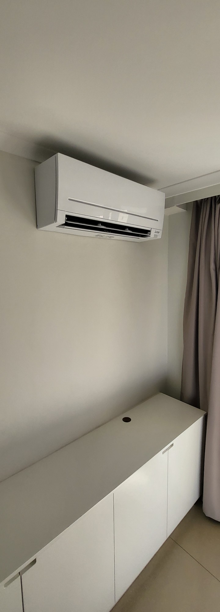 Mitsubishi Electric split system indoor unit installed in modern bedroom