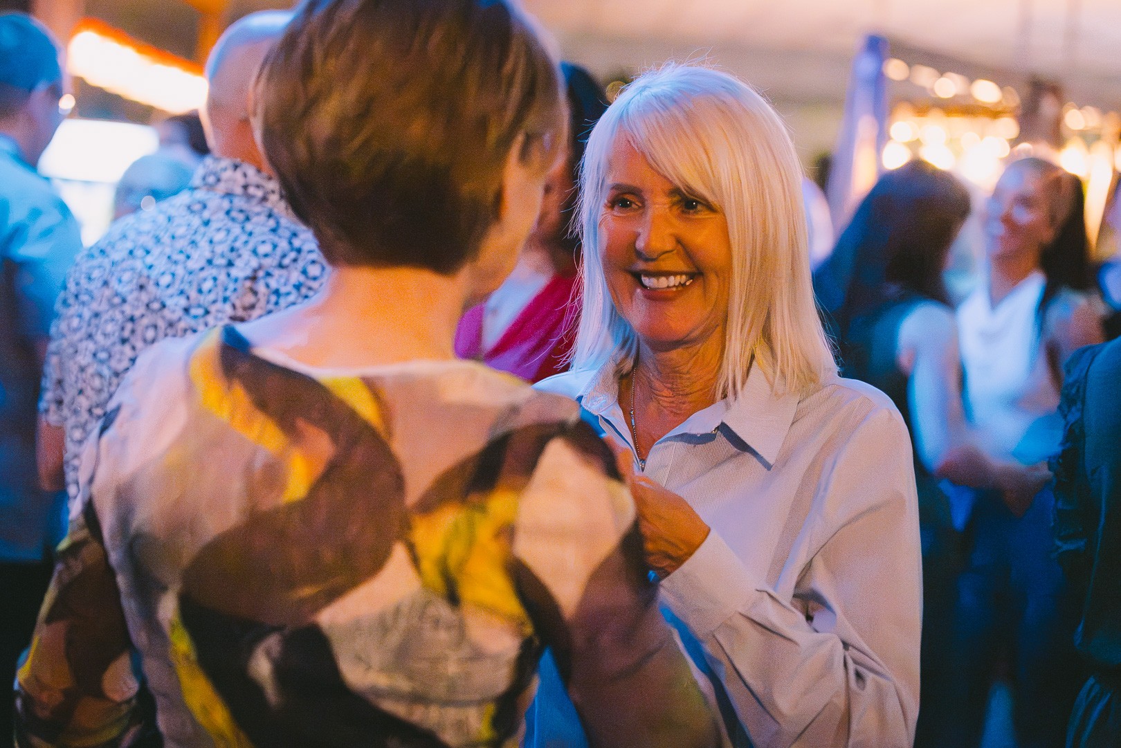 Smiling dancers on the social night dance floor