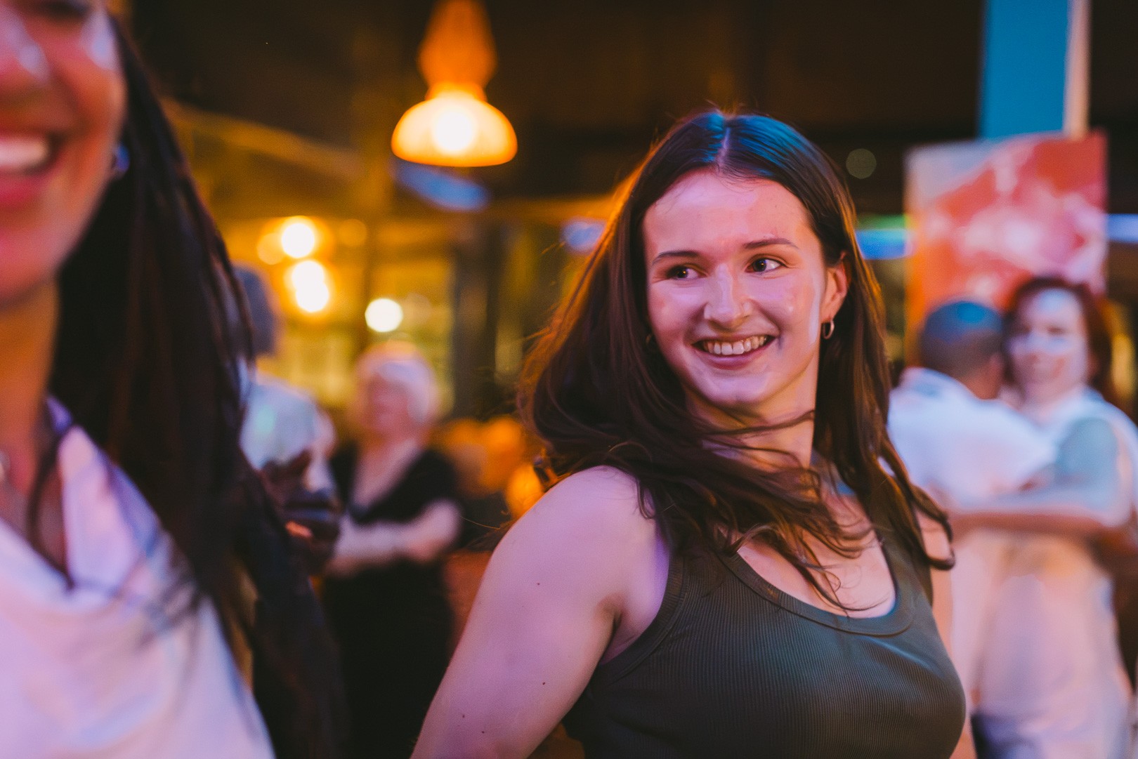 Dancers laughing during a salsa social